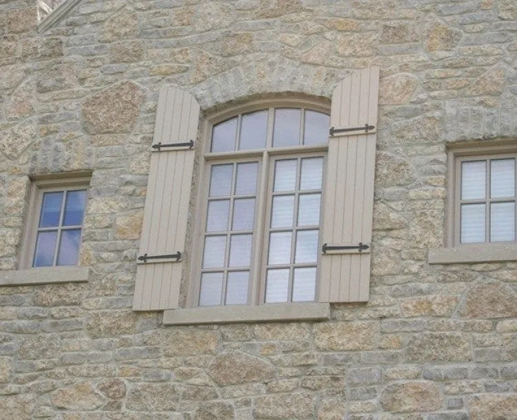 Close up home exterior with chateau real stone veneer