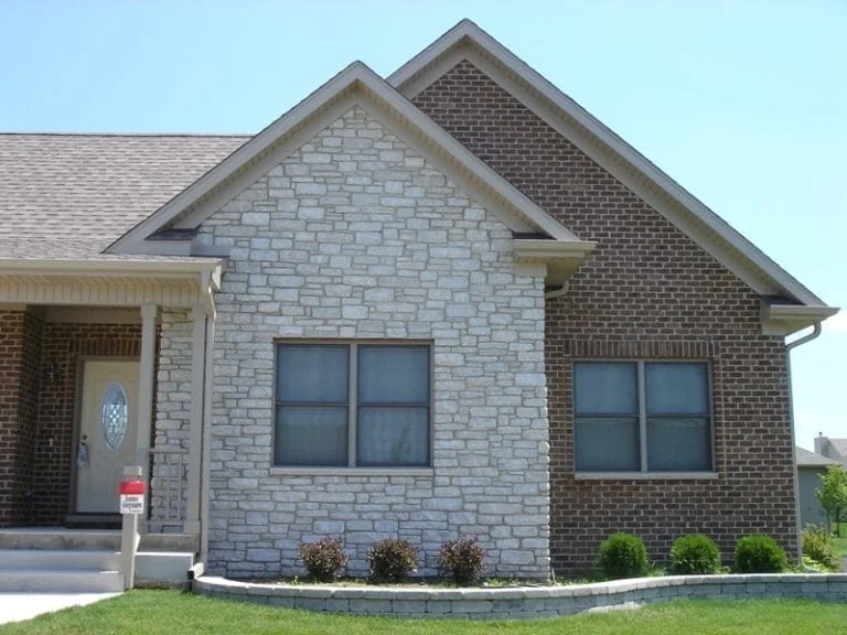 Promenade Tumbled Natural Stone Veneer Exterior with Brick