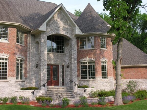 Exterior with Promenade tumbled real thin stone veneer