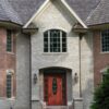 Front entrance accent wall with Promenade tumbled ashlar style real thin stone veneer