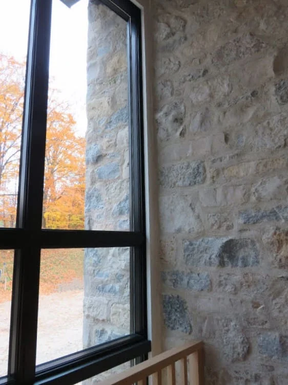Nottingham Custom Natural Stone Veneer Stairwell Flush Joint Tan Mortar