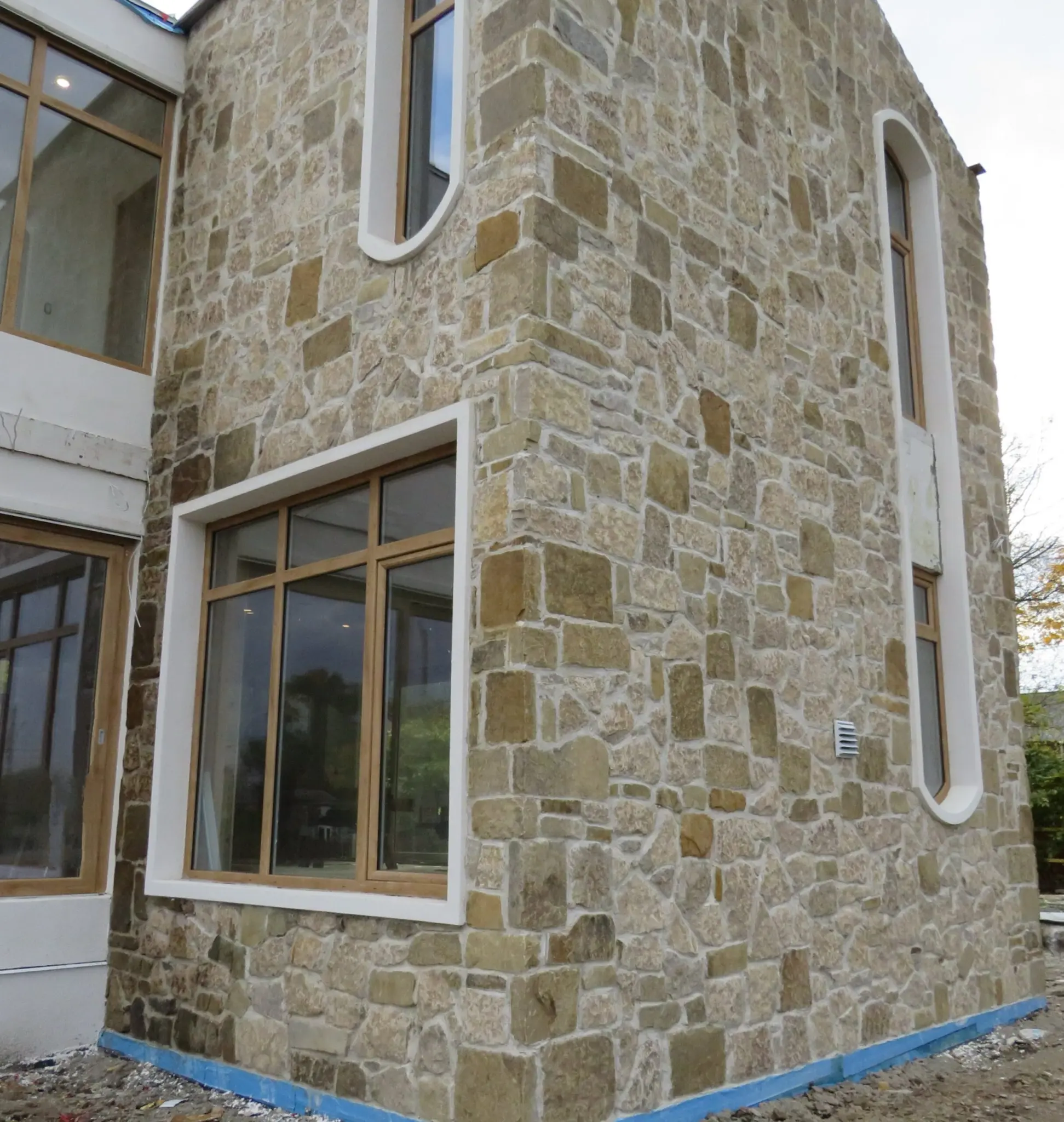 Colonial and Chateau with Large Pieces Real Stone Veneer Exterior