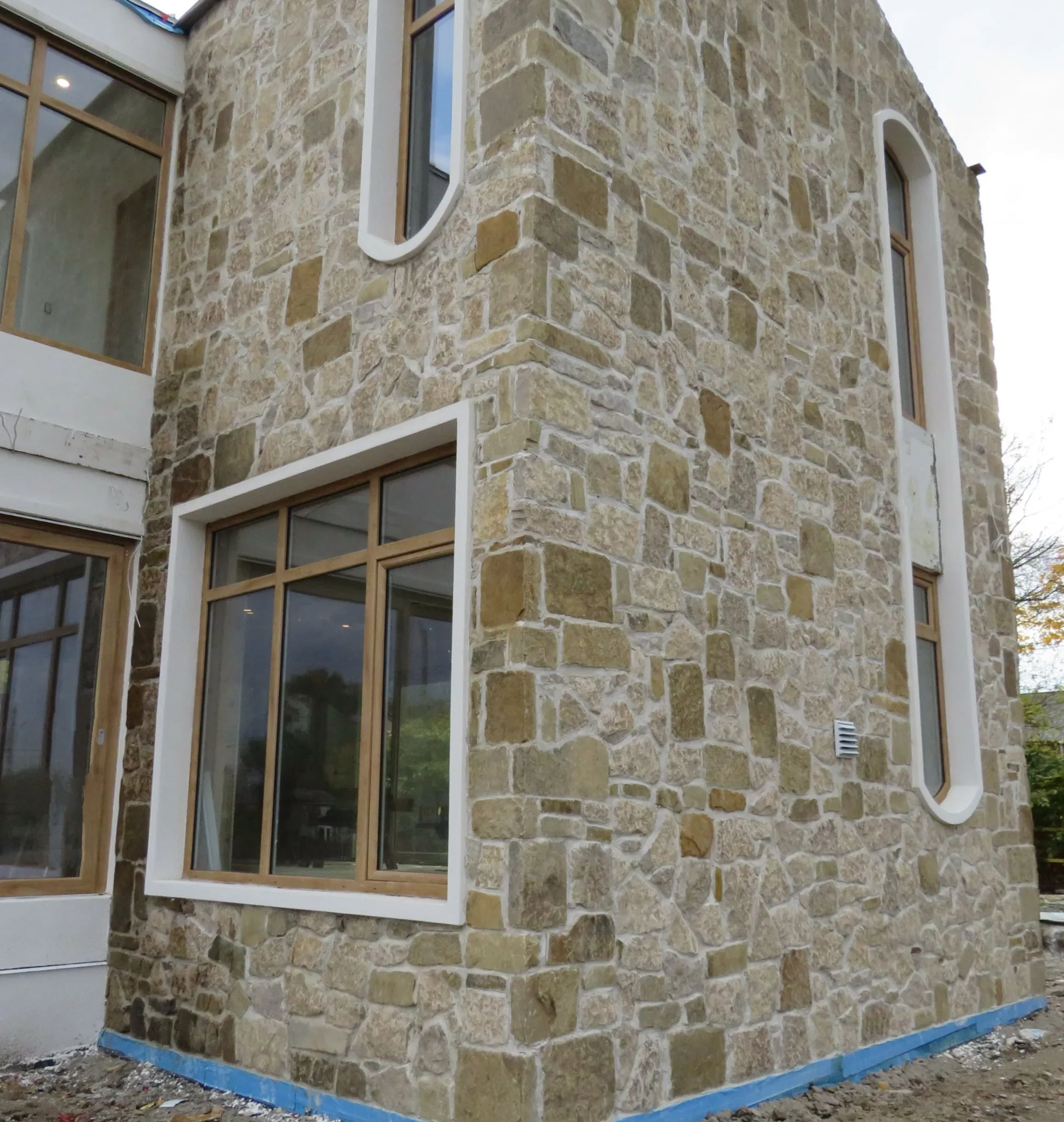 Colonial and Chateau with Large Pieces Real Stone Veneer Exterior